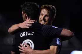 Will Grigg and Michael Jacobs will be waiting when Chesterfield host Latics next month