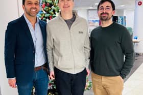 Sam Birchall, centre, with Mr Aziz Gulamhusein, left