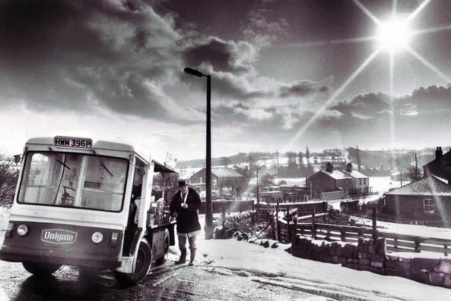A milkman stops for a warming cuppa during his rounds on Appley Lane South in Appley Bridge on the wintery Wednesday morning of January 25th in 1984.