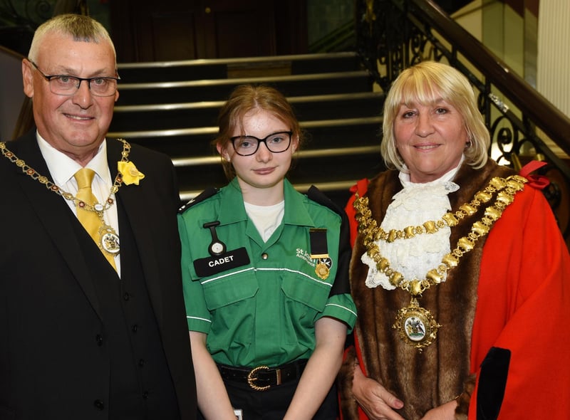 The new Mayor of Wigan Coun Marie Morgan, right, and consort coun Clive Morgan, left, welcome the Mayor's St John's Ambulance cadet Jessica McGowan, centre.