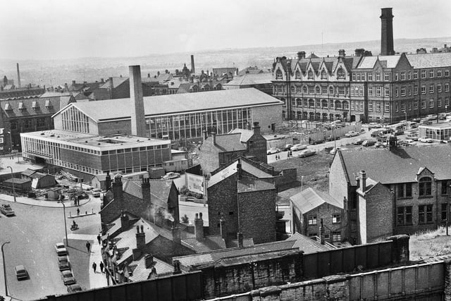 A view from Scholes railway bridge towards Wigan International Pool under construction in July 1966.
In the middle of the picture is the Bath Hotel on Millgate and right is the Powell Museum on Station Road.