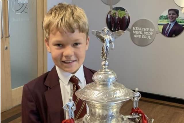 Dean Trust pupil Dylan with the Challege Cup trophy