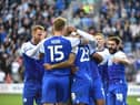 The Latics players celebrate Josh Magennis' goal against West Brom in midweek