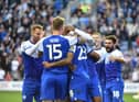 The Latics players celebrate Josh Magennis' goal against West Brom in midweek