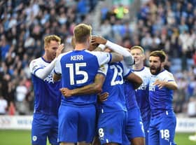 The Latics players celebrate Josh Magennis' goal against West Brom in midweek