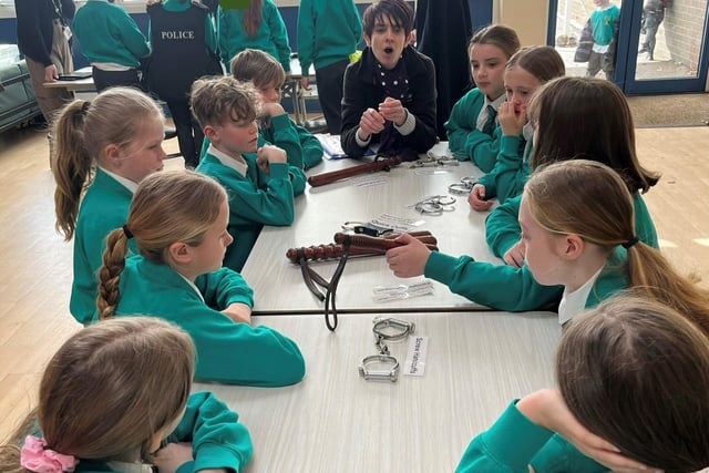 Pupils look at items from the Manchester Police Museum.
