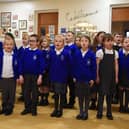 Pupils from the St Catharine's School Choir spread Christmas cheer as they perform Christmas songs to staff and service users at Central Day Centre, Wigan.