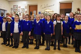 Pupils from the St Catharine's School Choir spread Christmas cheer as they perform Christmas songs to staff and service users at Central Day Centre, Wigan.