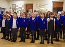Pupils from the St Catharine's School Choir spread Christmas cheer as they perform Christmas songs to staff and service users at Central Day Centre, Wigan.