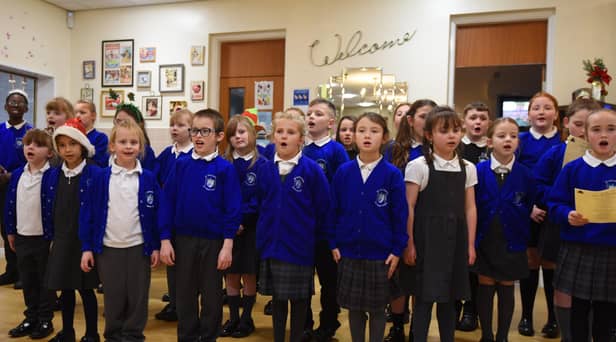 Pupils from the St Catharine's School Choir spread Christmas cheer as they perform Christmas songs to staff and service users at Central Day Centre, Wigan.