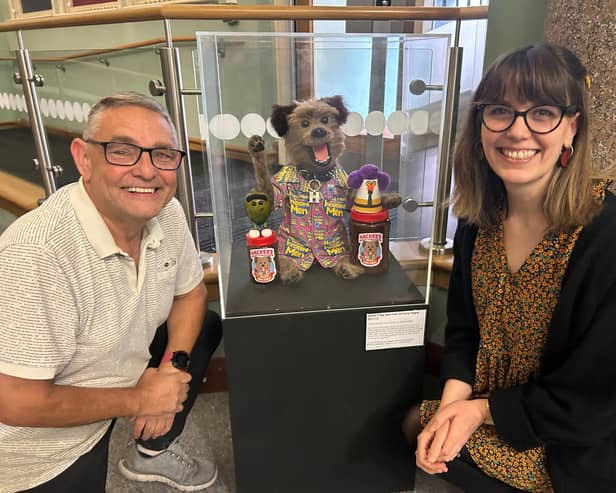Coun Chris Ready and Eleanor Whitehead, lead officer - museums, with the Hacker T Dog display at the Museum of Wigan Life