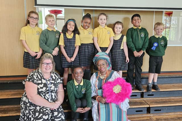 Elizabeth Garner, Bossi Okusanya and Year 2 Students at St Cuthberts Primary School.