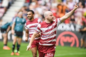 Liam Marshall celebrates his try against Leigh Leopards at the DW Stadium
