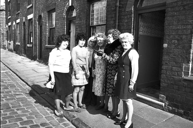 Retro 1975 Housewives gather in the streets of Ince to discuss the plans for demolition of their homes.