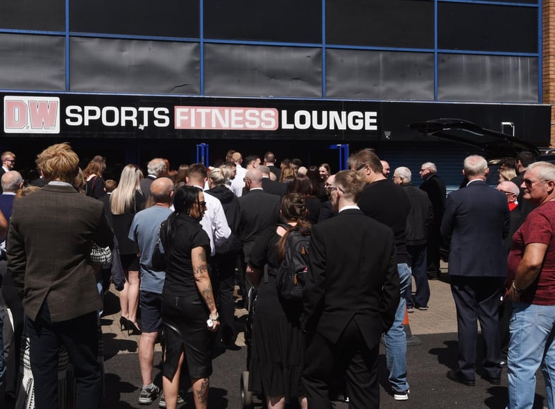 Hundreds of people gathered outside the DW Stadium ahead of the service.
