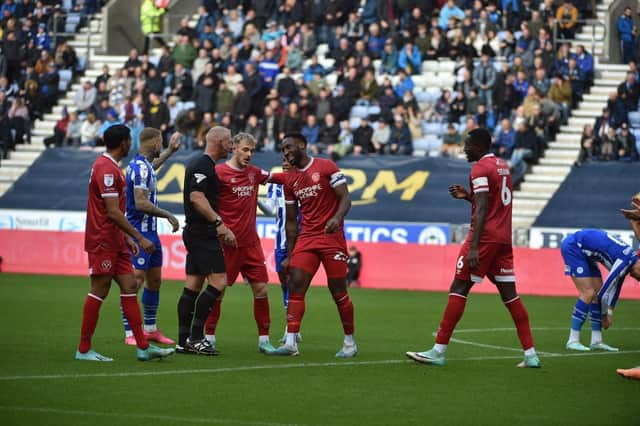 Chey Dunkley was sent off on his return to Wigan with Shrewsbury last year