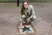 Football champion Ella Toone, Lioness and European Championship Winner, with her star, placed outside Leigh Town Hall.