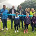 From left to right- Oscar Lorraine from developers Proludic Ltd, Deputy Leader Cllr Keith Cunliffe, Mayor of Wigan borough Coun Kevin Anderson, Mayoress Samantha Lloyd, David Shallcross of Leigh Ornithological Society and Dr Mark Champion of Lancashire Wildlife Trust with local children at the new Pennington Flash adventure playground