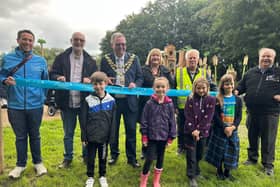 From left to right- Oscar Lorraine from developers Proludic Ltd, Deputy Leader Cllr Keith Cunliffe, Mayor of Wigan borough Coun Kevin Anderson, Mayoress Samantha Lloyd, David Shallcross of Leigh Ornithological Society and Dr Mark Champion of Lancashire Wildlife Trust with local children at the new Pennington Flash adventure playground