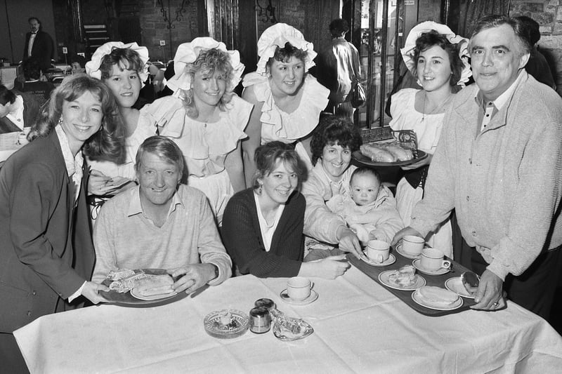 Coronation Street stars Helen Worth who played Gail Tilsley and Bill Tarmey, Jack Duckworth, help serving wenches to cater to Standish Lower Ground family the Hassalls at a "Have a Heart" charity day in aid of the British Heart Foundation at Park Hall on Sunday 9th of April 1989.