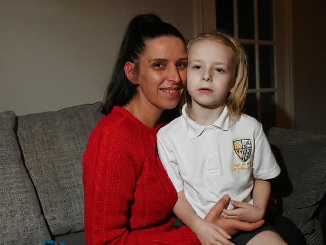 Levi Hewitt, five, from Leigh, is looking forward to Christmas, pictured with his mum Kealey Taylor.  Levi was seriously ill with meningitis and sepsis on his first day back to school in January this year.