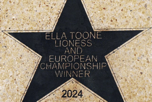 Football champion Ella Toone, Lioness and European Championship Winner, with her star, placed outside Leigh Town Hall.