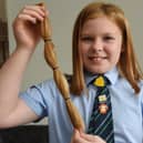 Poppy Touhey has cut off 12ins of her long hair to donate to the Little Princess Trust