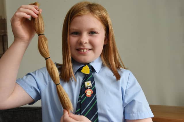 Poppy Touhey has cut off 12ins of her long hair to donate to the Little Princess Trust