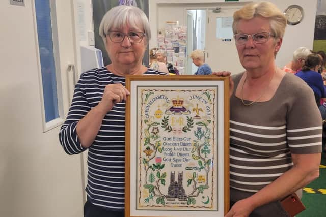 Jean Padgett and Julie Baxter with the finished embroidery