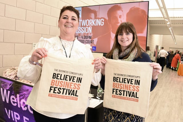 From left, Kerry Claxton and Anne Harry welcome visitors to the event.