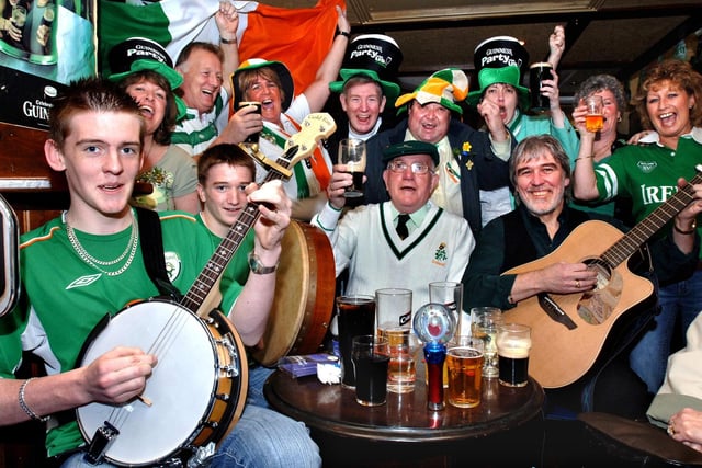 2005: Patrick Ryan on banjo, dad, John on guitar and Chris Smith on Bodhran sing in the Crofters pub in Market Street, Wigan, on St. Patrick's Day, Thursday 17th of March 2005.
John Ryan was a winger for Wigan Athletic in the 1960s.