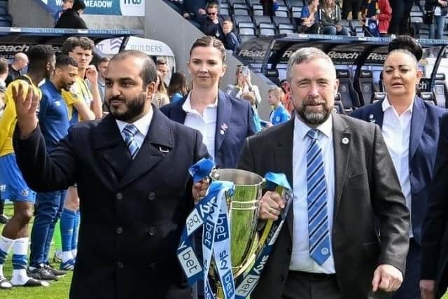 Talal Al Hammad and Mal Brannigan during happier times, with the League One title in 2022