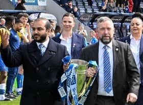 Talal Al Hammad and Mal Brannigan during happier times, with the League One title in 2022