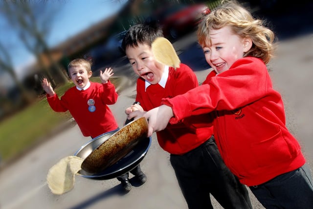 Pan-demonium at Sacred Heart Catholic Primary School, Springfield, where Laithe and Caroline enjoyed tossing the pancakes they had made with encouragement from Lorcan on Shrove Tuesday 28th of February 2006.