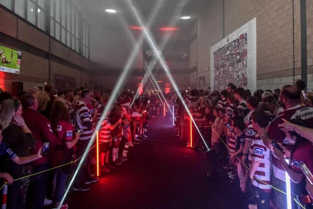 The Wigan Warriors squad walked through the Robin Park Arena fan village ahead of last season's game against Catalans Dragons