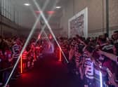 The Wigan Warriors squad walked through the Robin Park Arena fan village ahead of last season's game against Catalans Dragons