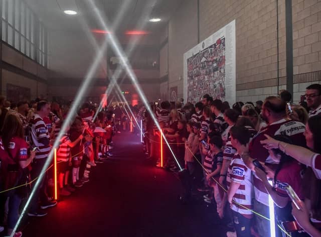 The Wigan Warriors squad walked through the Robin Park Arena fan village ahead of last season's game against Catalans Dragons