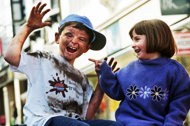 Robert Bolton, aged 7, from Standish was voted Wigan's grubbiest kid in February 2000. He battled against 100 other mucky youngsters in a competition organised by Ariel Hygiene Antibac in association with BHS winning £150 worth of vouchers and going through to the national finals. Robert's mum had sent in a photograph of him at his grubbiest which impressed the judges and his sister Sophie pictured here with him.