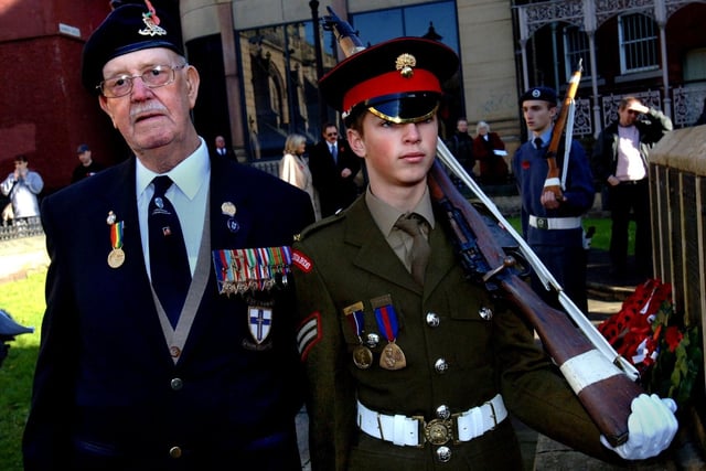RETRO 2005  - D-Day veteran John Simm of the Royal Artillery with neighbour from Montrose Avenue Grenadier Guards cadet Gareth Whitehill at Wigan cenotaph. Picture Frank Orrell.