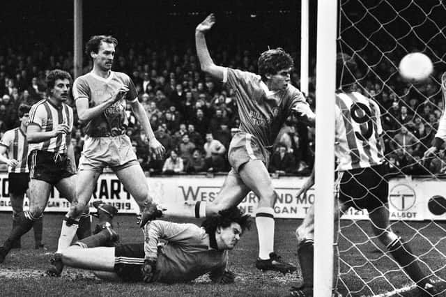 Wigan Athletic striker, David Lowe, heads home his goal against Lincoln City in the Division 3 match at Springfield Park on Saturday 15th of January 1983.
Graham Barrow scored the other goal in a 2-1 win.
