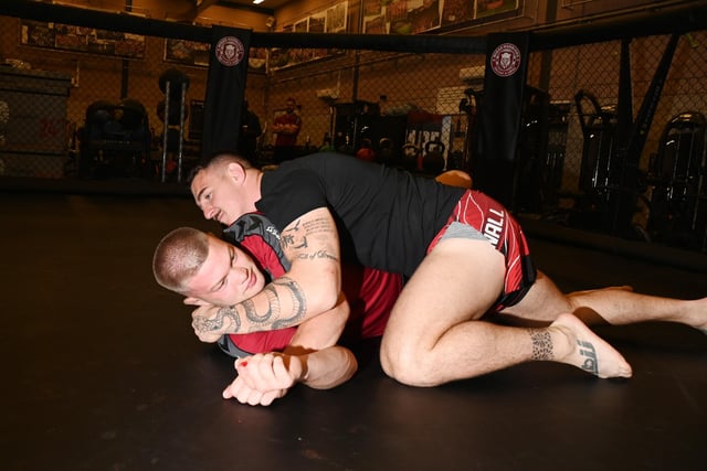 UFC heavyweight Tom Aspinall in training with Wigan Warriors' Morgan Smithies.