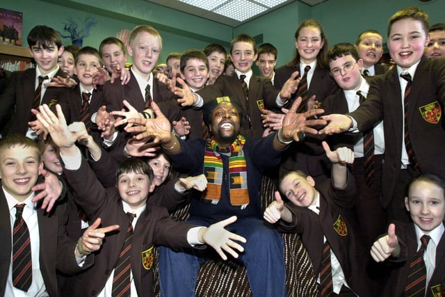 Pupils of St. Peter's RC High School, Orrell, join in a chant with Rastafarian poet Levi Tafari during a visit on Tuesday 5th of March 2002.