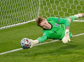 England's goalkeeper Jordan Pickford saves a penalty during the UEFA EURO 2020 final football match between Italy and England at the Wembley Stadium in London on July 11, 2021. (Photo by JOHN SIBLEY / POOL / AFP) (Photo by JOHN SIBLEY/POOL/AFP via Getty Images)