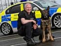 Portrait of PC Mark Richardson with his police dog Mo.
