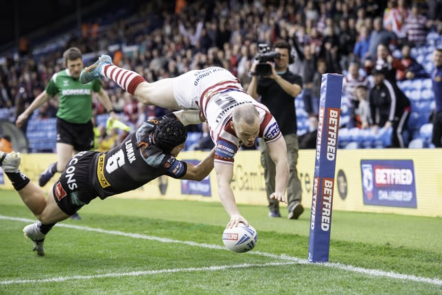 Liam Marshall dives over for the first try of the game.