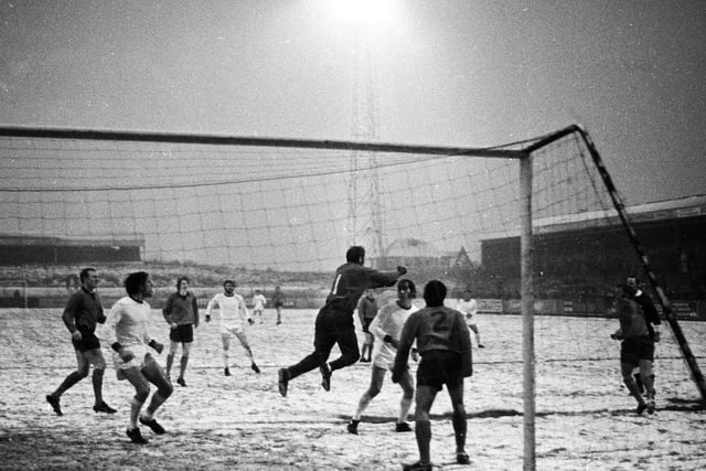 WAFC v Halifax FA Cup 1st round - Players on the snow-covered pitch.