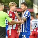 Josh Magennis received one of a dozen yellow cards issued to the visitors at Stevenage