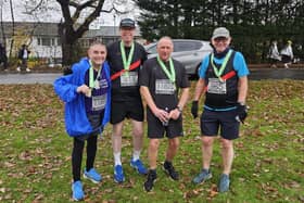 Councillors Chris Ready and Paul Kenny celebrate finishing the Wilmslow Festive 10k with Ian Fawcett and former councillor Jim Moodie