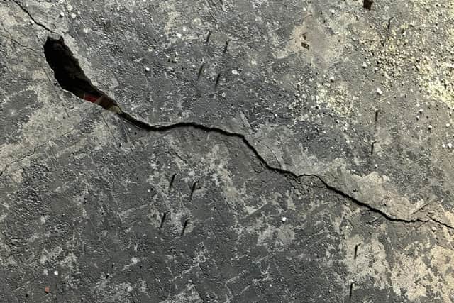 The main crack in the floor of the Old Courts that has had a devastating effect on the arts organisation's activities