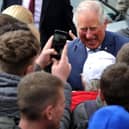 HRH Prince Charles visits the Wm Santus factory in Wigan, makers of the famous Uncle Joe's  Mintballs with John and Anthony Winnard. Children from St Andrew's Primary School wait for the Prince's arrival. Picture by Paul Heyes, Wednesday April 03, 2019.

























